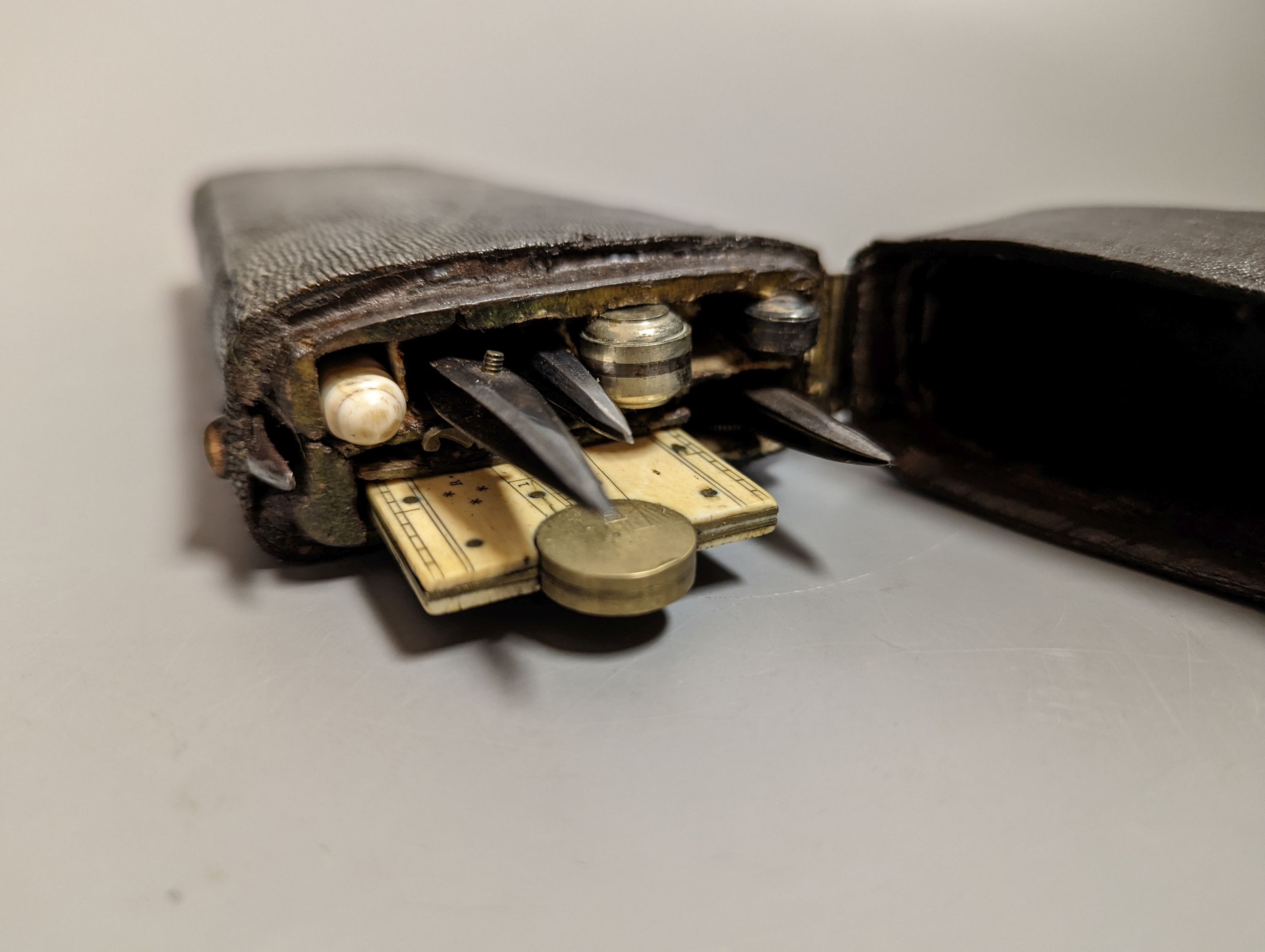 A Georgian shagreen cased draughtsman’s set, including a folding ivory rule, 17.5cm